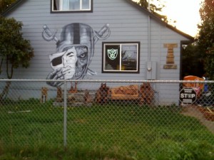 or1 The wood plaques on the right list the members of the household, highlighting their Raiders affiliation